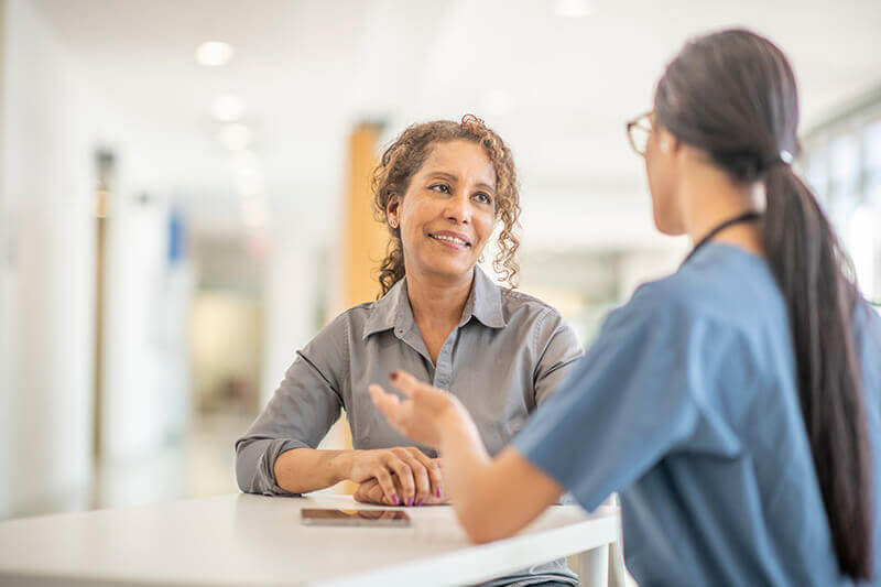 doctor or scientist explains to patient