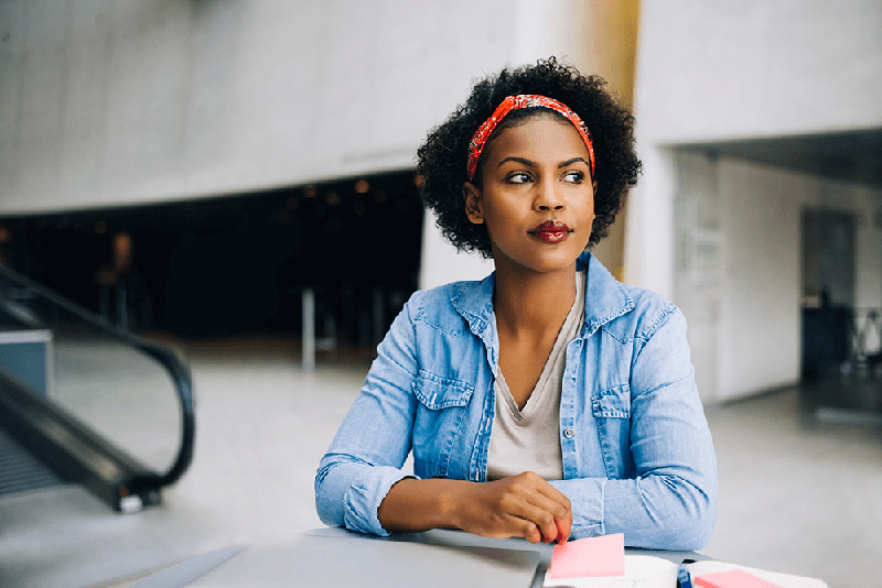 young female entrepreneur thinking